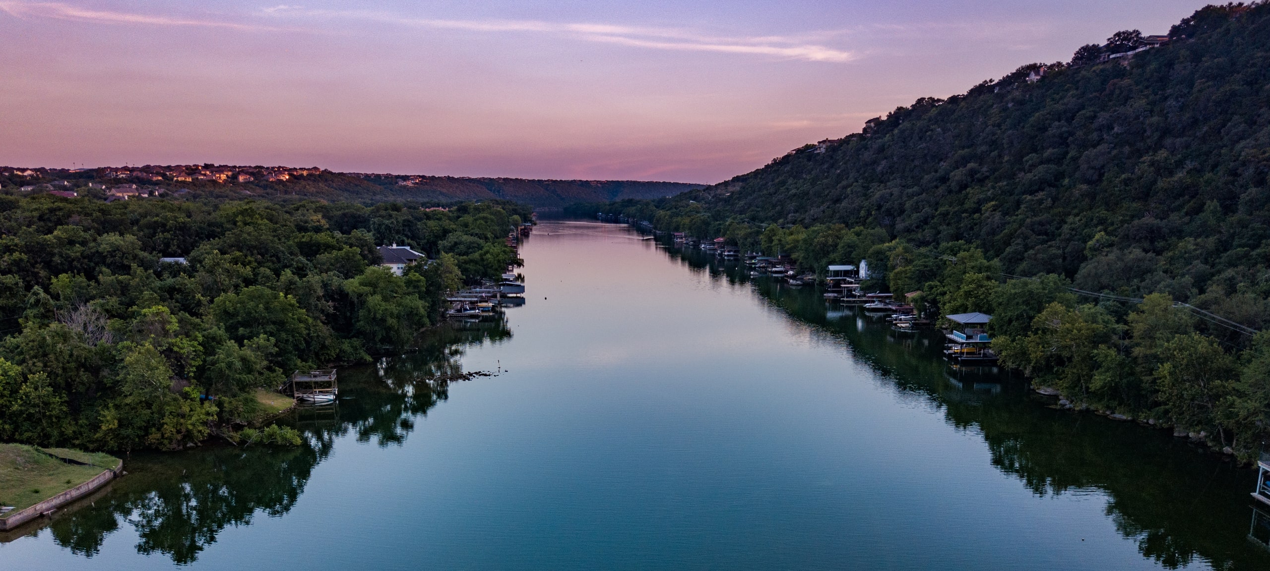 Pink sunset over Colorado River Lake Travis in Lakeway area of Austin